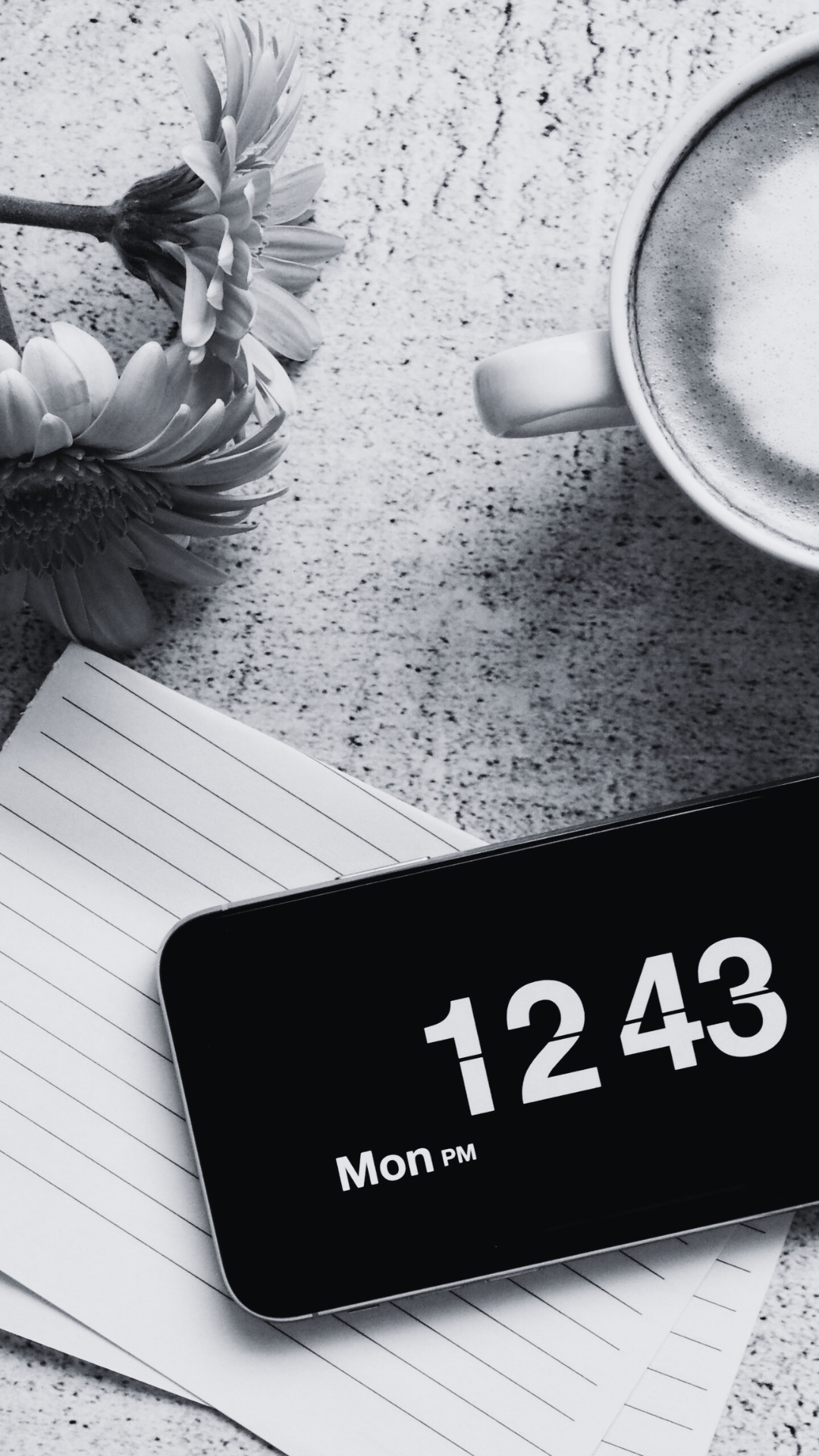 Digital clock, notebook, coffee and flower in black & white